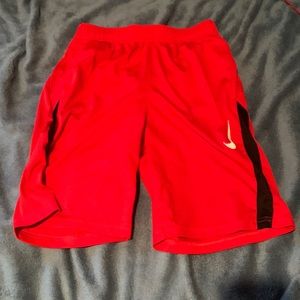 Red Nike running shorts
